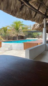 a view of a swimming pool in a resort at Coco Beach in El Paredón Buena Vista