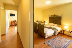 Postel nebo postele na pokoji v ubytování Locanda Villa d' Epoca
