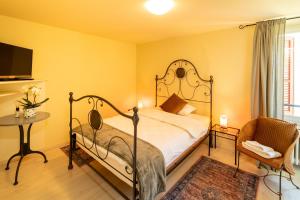 Postel nebo postele na pokoji v ubytování Locanda Villa d' Epoca