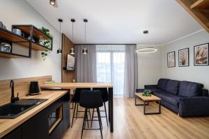 Apartamenty i Pokoje Złote Piaski的休息区