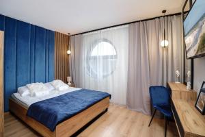 Apartamenty i Pokoje Złote Piaski客房内的一张或多张床位