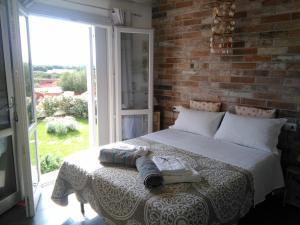 A bed or beds in a room at Oltre le Dune