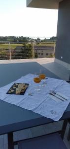 a table with two wine glasses on top of it at A CASA MIA b&b in Cavaion Veronese