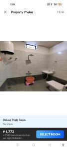a picture of a bathroom with a sink and a room at Hotel Raj Krishanam in Khātu
