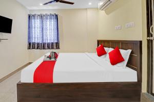 מיטה או מיטות בחדר ב-Flagship Gn Nelli Suites