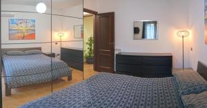 מיטה או מיטות בחדר ב-Aria di casa