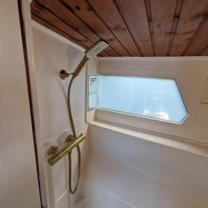 a bathroom with a door with a window at City Sailing in Amsterdam