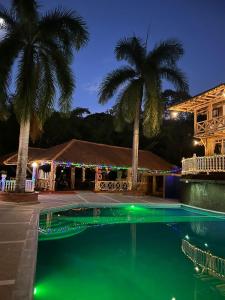 Bazén v ubytování Hotel campestre los Arrieros nebo v jeho okolí