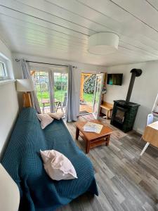 a bedroom with a bed and a wood stove at Ferienwohnung Niesky in Niesky