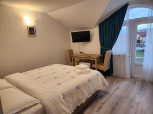 Postel nebo postele na pokoji v ubytování Vila Reghina
