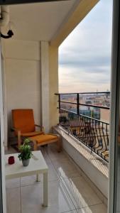a balcony with a chair and a view of the ocean at LG colosseum Rome apartment in Rome