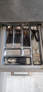 a drawer in a kitchen with utensils in it at ewja 4 in Sulęcin