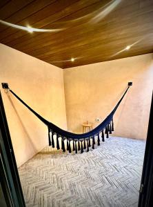 a room with a hammock in the corner of a room at Hotel Boutique Miranda in Oaxaca City