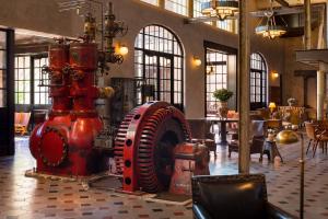 a red fire hydrant in the middle of a room at Hotel Emma at Pearl on the Riverwalk in San Antonio