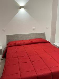 Een bed of bedden in een kamer bij Affittacamere “In Piazzetta”