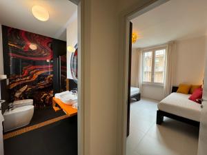 a bathroom with a sink and a toilet in a room at Sette Note Guest House in Arezzo