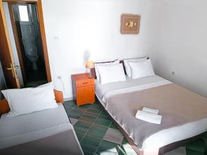 Llit o llits en una habitació de Amisos Apartmani