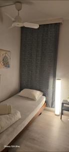 Postel nebo postele na pokoji v ubytování Holiday Suite 304 Residenza Lago di Lugano + 13 fotografií
