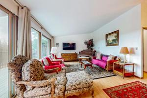 a living room with two chairs and a couch at Pacific Prairie in Woodinville