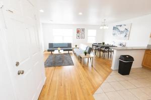 a living room with a couch and a table at Elegant & Spacious 3-Bed Space near NYC in Jersey City