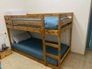 a couple of bunk beds in a room at Cal Sol in Calafell