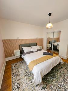 a bedroom with a large bed with a rug at Ottawa Downtown Cozy Guesthouse in Ottawa