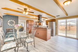 a kitchen and dining room with a glass table and chairs at Family-Friendly Ontario Home in Central Location! in Ontario
