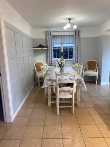 a dining room with a table and chairs at House in Mid Ulster - Sleeps 8 in Draperstown