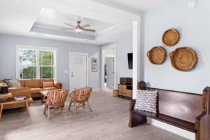 a living room with a couch and chairs at Live Oak Villa~OKI Beach Retreat in Oak Island