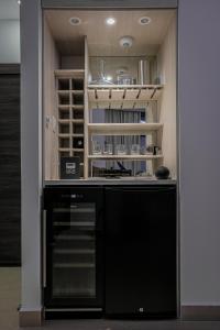 a kitchen with a black dishwasher in a room at Green Platinum Hotel in Tonsupa