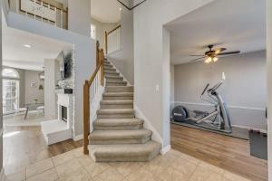 a staircase in a home with a gym at Luxury 5 BR Jacuzzi Gym Near Lake for large Fam in Rowlett