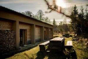 a building with a bench in front of it at Na samotě u lesa - Jeseníky in Mikulovice