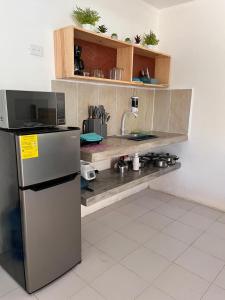 Kuchyň nebo kuchyňský kout v ubytování Departamento Dzirul