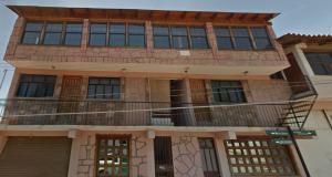 a large building with a balcony on top of it at El Mesón de Don Quijote in Mazamitla