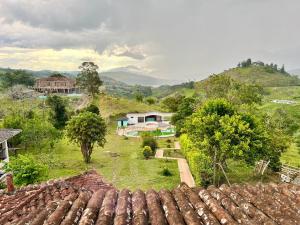 a view of a village with houses and trees at Finca Calimita in Calima