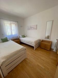 Postel nebo postele na pokoji v ubytování Villa Maximilian
