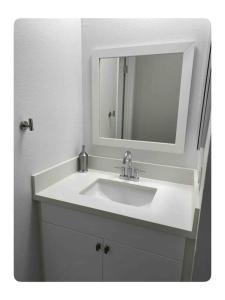 a bathroom with a white sink and a mirror at Gorgeous 1 bedroom Beverly Hills in Los Angeles