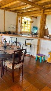 a dining room with a table and chairs in a room at Sinadan in Barbosa