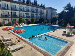 a group of people in a swimming pool in a hotel at Uyum Hotel in Pamukkale