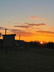 The sunrise or sunset as seen from az apartmanházakat or nearby