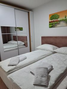 Postel nebo postele na pokoji v ubytování Apartman Bross