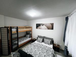 Postel nebo postele na pokoji v ubytování Fara No71 apart 2 + 1 fotografie
