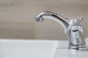 a bathroom sink with a silver faucet at Canto do Atlântico Loft (City Centre) in Ponta Delgada