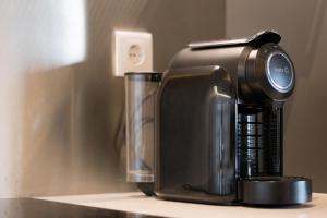 a coffee maker sitting on top of a counter at Canto do Atlântico Loft (City Centre) in Ponta Delgada