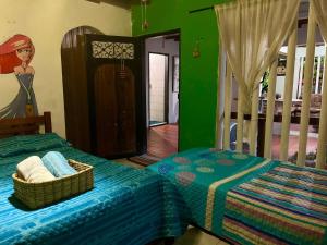 En eller flere senge i et værelse på Green House's