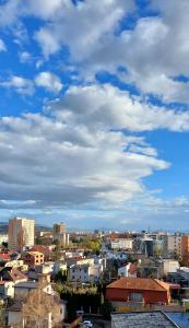 a view of a city under a cloudy sky at Apartmán Porte in Košice