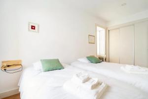 Ένα ή περισσότερα κρεβάτια σε δωμάτιο στο Cosy house for Surf & Beach