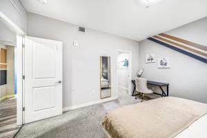a bedroom with a bed and a desk at Olympic Pool & Steam in Downtown Playhouse Square in Cleveland