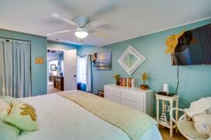 a bedroom with a bed and a ceiling fan at Cozy Fort Pierce Cottage on Farm Animal Rescue! in Fort Pierce