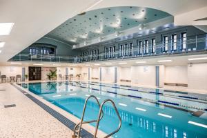 a large indoor pool with a large swimming pool at Olympic Pool & Steam in Downtown Playhouse Square in Cleveland
